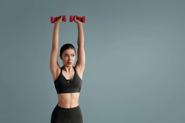 Young Woman Doing Dumbbell Workout Working Arms Strength Looking Copy — Stockfoto