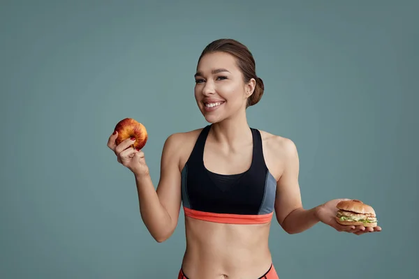 Woman Making Choice Apple Hamburger Dieting Concept — Stockfoto