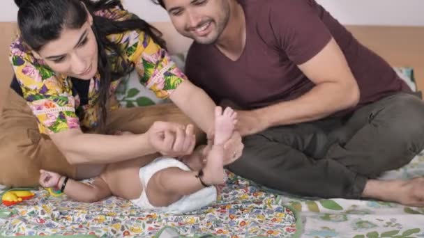Caring Mother Putting Kala Teeka Her Little Baby Feet Baby — Stock Video