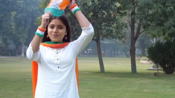 Happy Teenage Girl Posing While Wearing Tricolor Hat Standing Open — Stockvideo