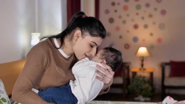 Caring Indian Mother Sitting Living Room Playing Her Cute Infant — Stock Video