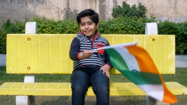 Smiling Indian Kid Holding Waving National Flag Republic Day Celebrations — Video Stock