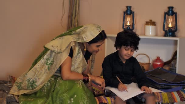 Rural Housewife Indian Village Helping Her Cute Son His Homework — Stock Video