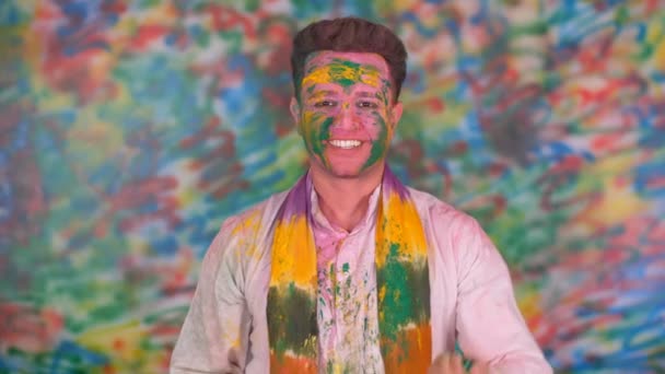 Man White Kurta Blowing Gulal His Hand Eve Holi Colorful — Stock Video