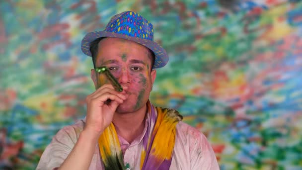 Cute Asian Guy Celebrating Holi While Playing Party Blower Party — Stock Video