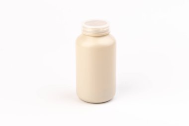 İlaç kavanozu. Hafif arka planda uyuşturucu, diyet ve besin takviyeleri için tıbbi konteyner.