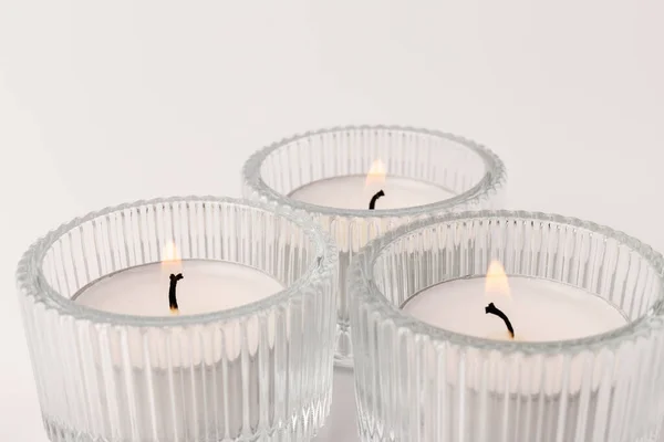 Small Burning Wax Candles Glass Candlestick Isolated White Beautiful Decor — Stock Photo, Image