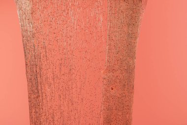 Pembe arka planda parlak balçık. Şeffaf oyuncak. Pembe kız renkleriyle parıltılı desen.