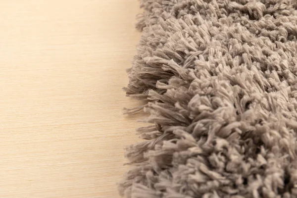 Gray chenille soft bath mat texture background. Bath Accessories. Close up.