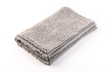 Gri kadife yumuşak banyo paspası dokusu. Banyo aksesuarları. Kapat..