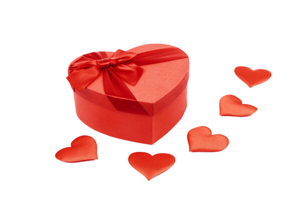 Red heart-shaped gift box with a red ribbon on white background. Happy Valentine's Day. Anniversary. 