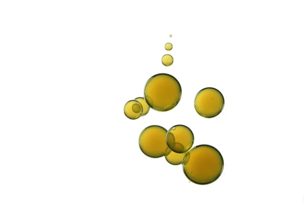 Eine Gruppe Gelber Blasen Auf Weißem Hintergrund — Stockfoto