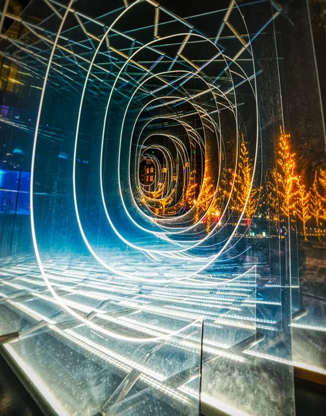 Transparent tunnel or mirrored looks like virtual reality or metaverse at night. Dark, fictional universe representation with a translucent burrow or hole like a passage through time and dimensions