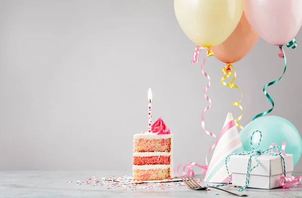 Slice Pink Funfetti Birthday Cake Candle Presents Hats Colorful Balloons — Stock Photo, Image