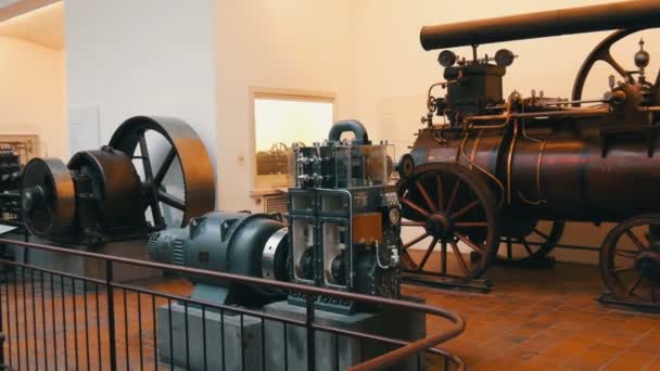 Munich, Germany - October 24, 2019: Deutsches Museum, The largest museum of natural science and technology in world, Old vintage iron locomotive trains and parts at an exhibition — Stock Video