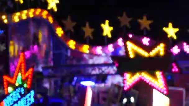 Intentionally blurred footage of multi-colored light from the attractions. Bokeh Lights at Night — Stock Video