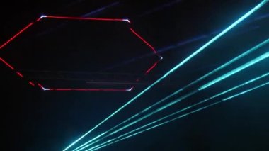 Light laser show on a black background of the night sky, outdoor performance. Multi-colored laser beams turn into various shapes, projection on smoke. Information Technology Conference.