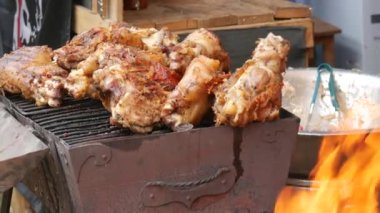 Grilled salmon fillets on a grill plate sprinkled with salt flakes