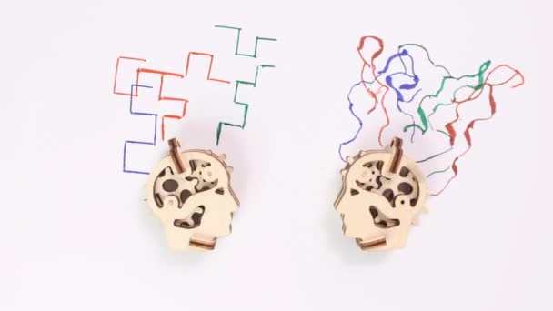 Stop Motion Animation Two Wooden Mechanical Heads Draw Various Abstractions — Vídeos de Stock