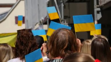 June 25, 2022 - Offenburg, Germany: Ukrainians in national costumes with embroidered shirts with Ukrainian symbols and flags in demonstration support of Ukraine against war with Russia.