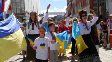 June 25, 2022 - Offenburg, Germany: Ukrainians in national costumes with embroidered shirts with Ukrainian symbols and flags in demonstration support of Ukraine against war with Russia.