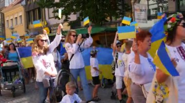 June 25, 2022 - Offenburg, Germany: Ukrainians in national costumes with embroidered shirts with Ukrainian symbols and flags in demonstration support of Ukraine against war with Russia.