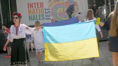 June 25, 2022 - Offenburg, Germany: Ukrainians in national costumes with embroidered shirts with Ukrainian symbols and flags in demonstration support of Ukraine against war with Russia.