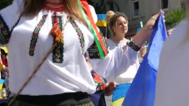 June 25, 2022 - Offenburg, Germany: Ukrainians in national costumes with embroidered shirts with Ukrainian symbols and flags in demonstration support of Ukraine against war with Russia.
