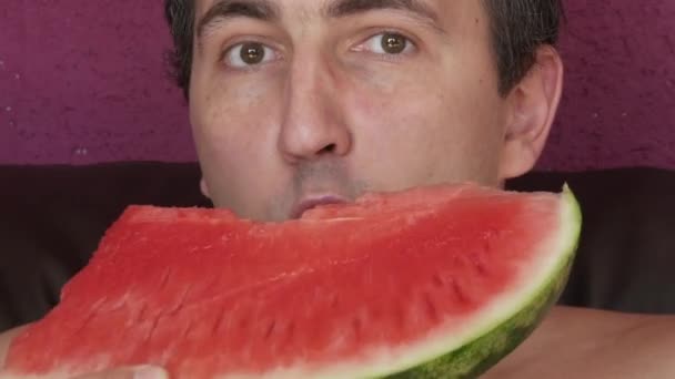 Young Handsome Man Appetite Eats Slice Red Ripe Juicy Watermelon — Stockvideo