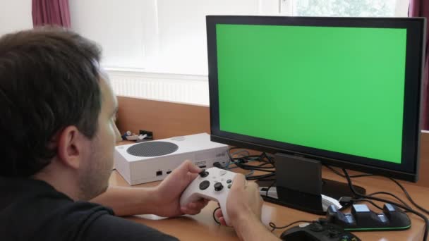 Young Male Gamer Playing Game Console Using Joystick Remote Control — Stockvideo