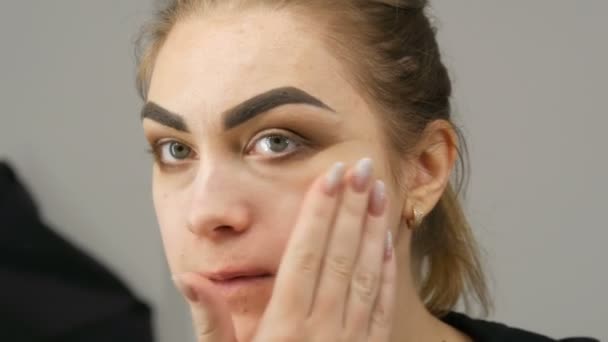 Tired Makeup Girl Model Leads Fingers Skin Face Front Mirror — Stock Video