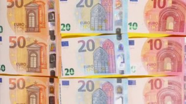 Hareket animasyonunu durdurun. Avrupa nakit makro görüntüsü. Finansal kriz. Doku. Finans İşletmeleri Yatırım Başarı Konsepti. Euro parası. 50, 10, 20 Euro. En üstten izleniyor. Sarı arka planda