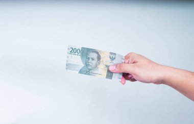 Zihin Bölümü Man Hand Endonezya 'ya seçici odak olarak 2000 Rupi verdi