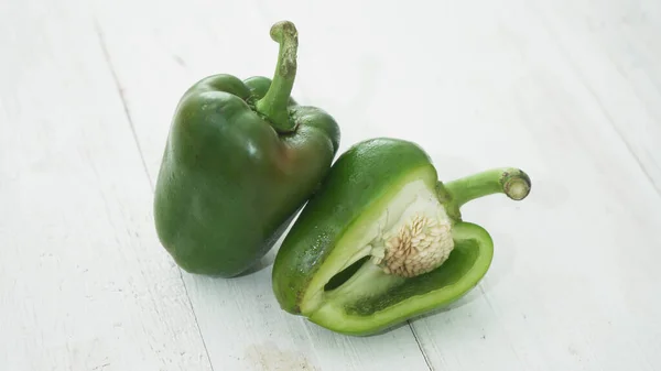 Organic Green bell pepper isolated on white background in selective focus