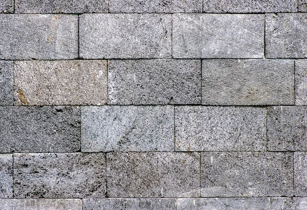 天然の暗い石畳の壁の背景 — ストック写真