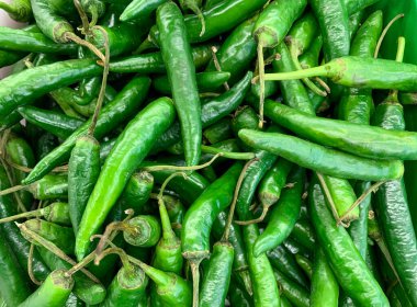 Top view of ripe green chilli pepper on supermarket