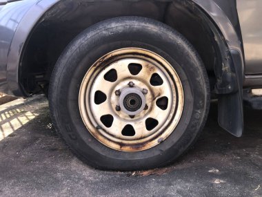 Selangor, Malaysia: January 10, 2021- Slight flat tyre on road because of nail pounding