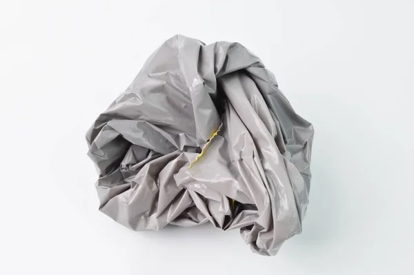 Grau Zerknüllter Kunststoff Isoliert Auf Weißem Hintergrund — Stockfoto