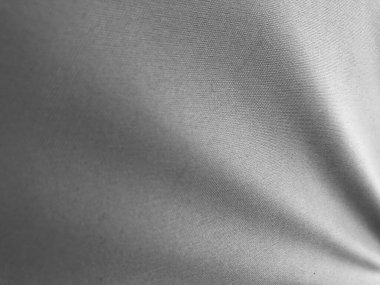 Perde kumaşının arka planının siyah ve beyaz görüntüsü. Kahverengi kumaş yumuşak dalga