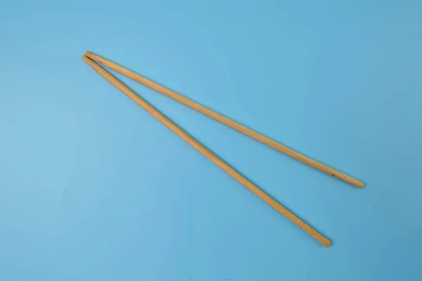 Wooden Chopsticks Isolated Blue Background — Stock Photo, Image