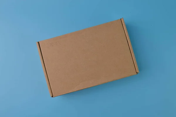 Brown Paper Box Isolated Blue Background — ストック写真