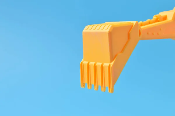 Plastic Digger Toy Isolated Blue Background — 스톡 사진
