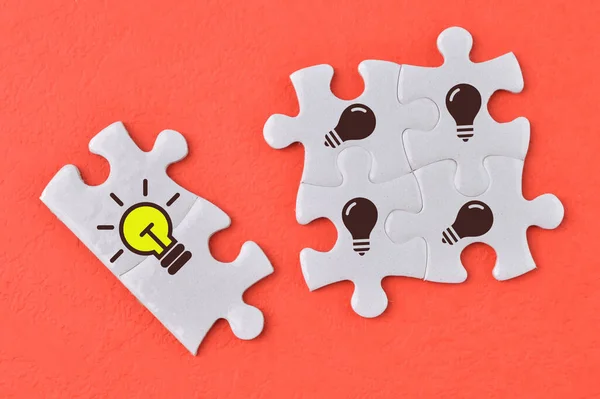 Jigsaw Puzzles Light Bulb Symbols Concept Innovation New Idea Creative — Foto de Stock