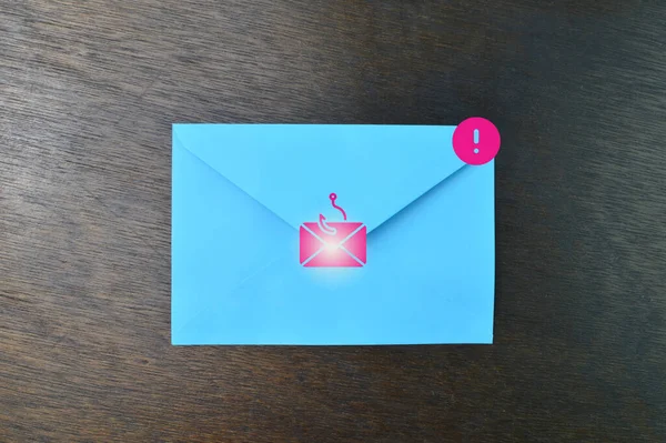 Blue envelope with email phishing scam and hacking online scam symbol