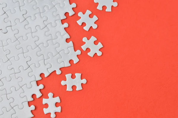 Jigsaw Puzzle White Pieces Isolated Red Background — Foto de Stock