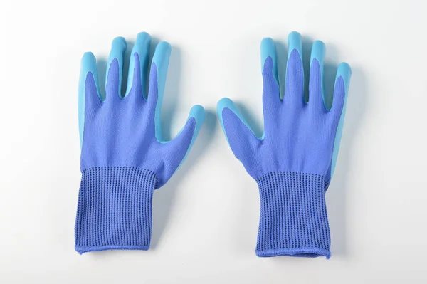 Blue rubber protective glove isolated on a white background