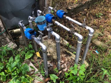 Flow meter pipes for measuring the water consumption, valves and fittings for water supply system connecting the houses to the main pipeline.