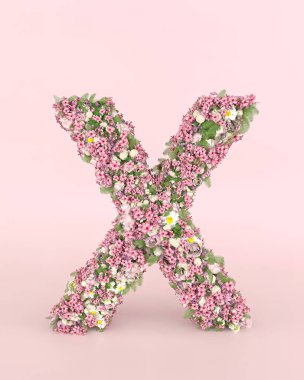Creative letter X concept made of fresh Spring wedding flowers. Flower font concept on pastel pink background.