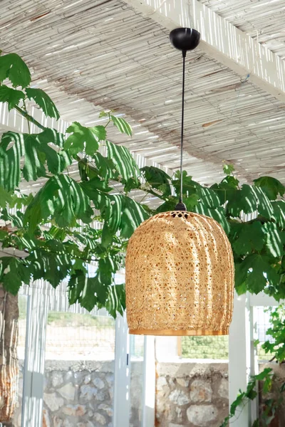 Pendant light with wicker lampshade,mediterranean style. Light and shade