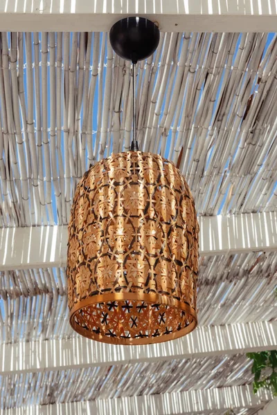 Pendant light with wicker lampshade,mediterranean style. Light and shade